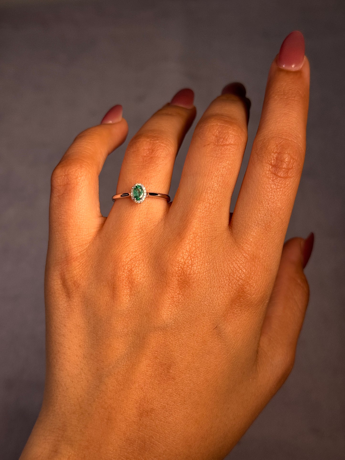 Oval Emerald & Diamond Halo Ring, 18K White Gold.