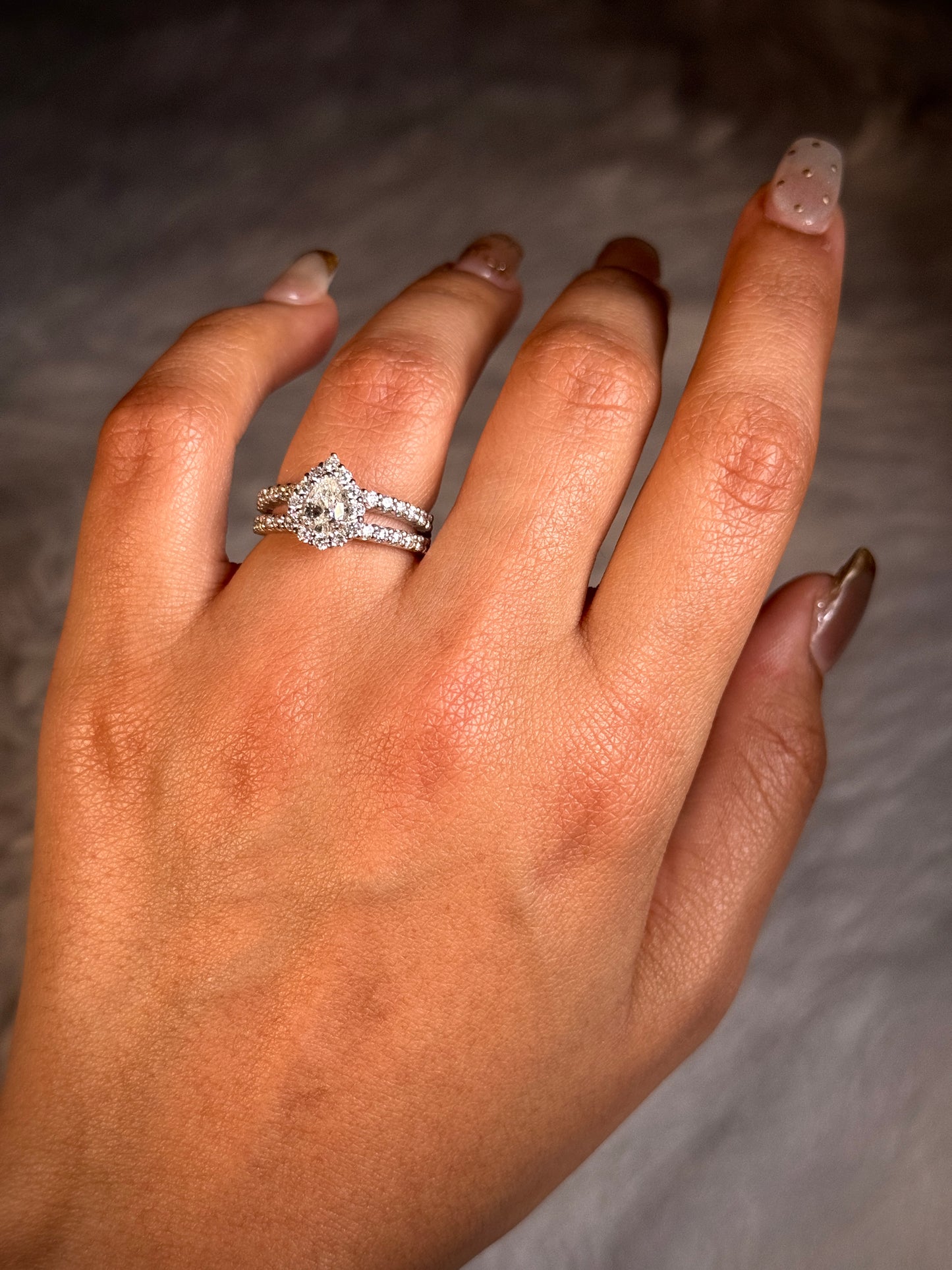 0.50ct Pear Cut Centre, 36=1.08ct RBC Diamonds, 18K White Gold Ring.