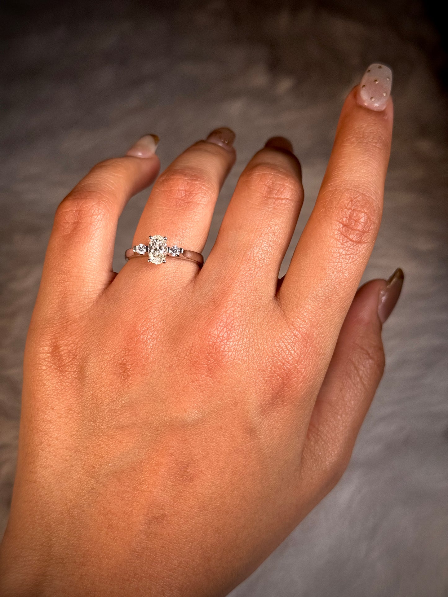 Trilogy Oval Diamond Ring, T=0.83 Carat, 18 Carat White Gold.