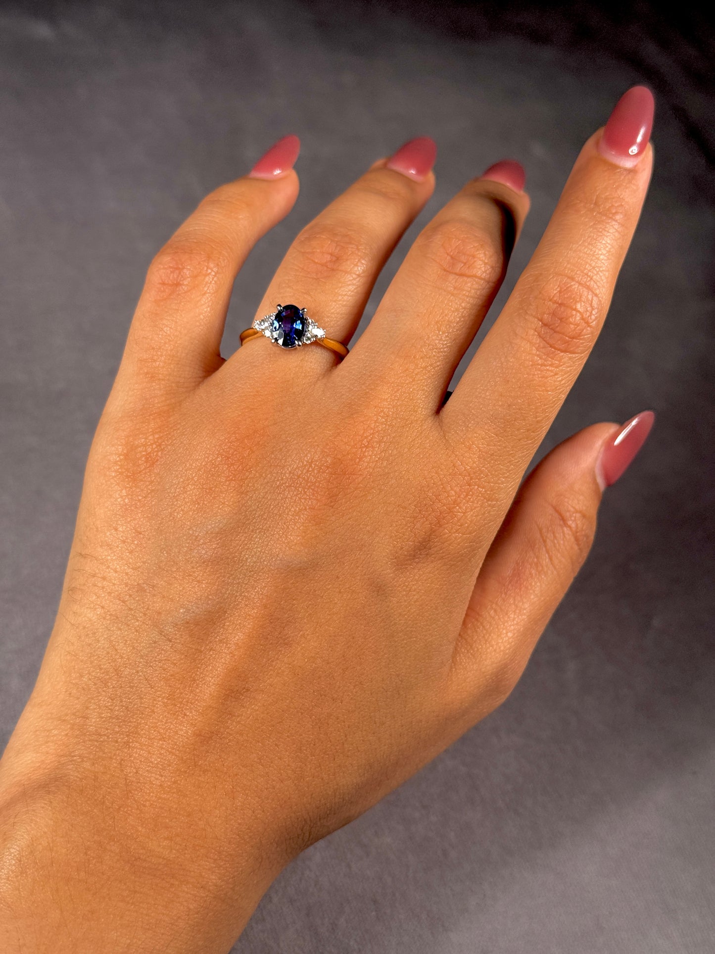 Oval Sapphire & Diamond Ring in 18 Carat Yellow Gold.