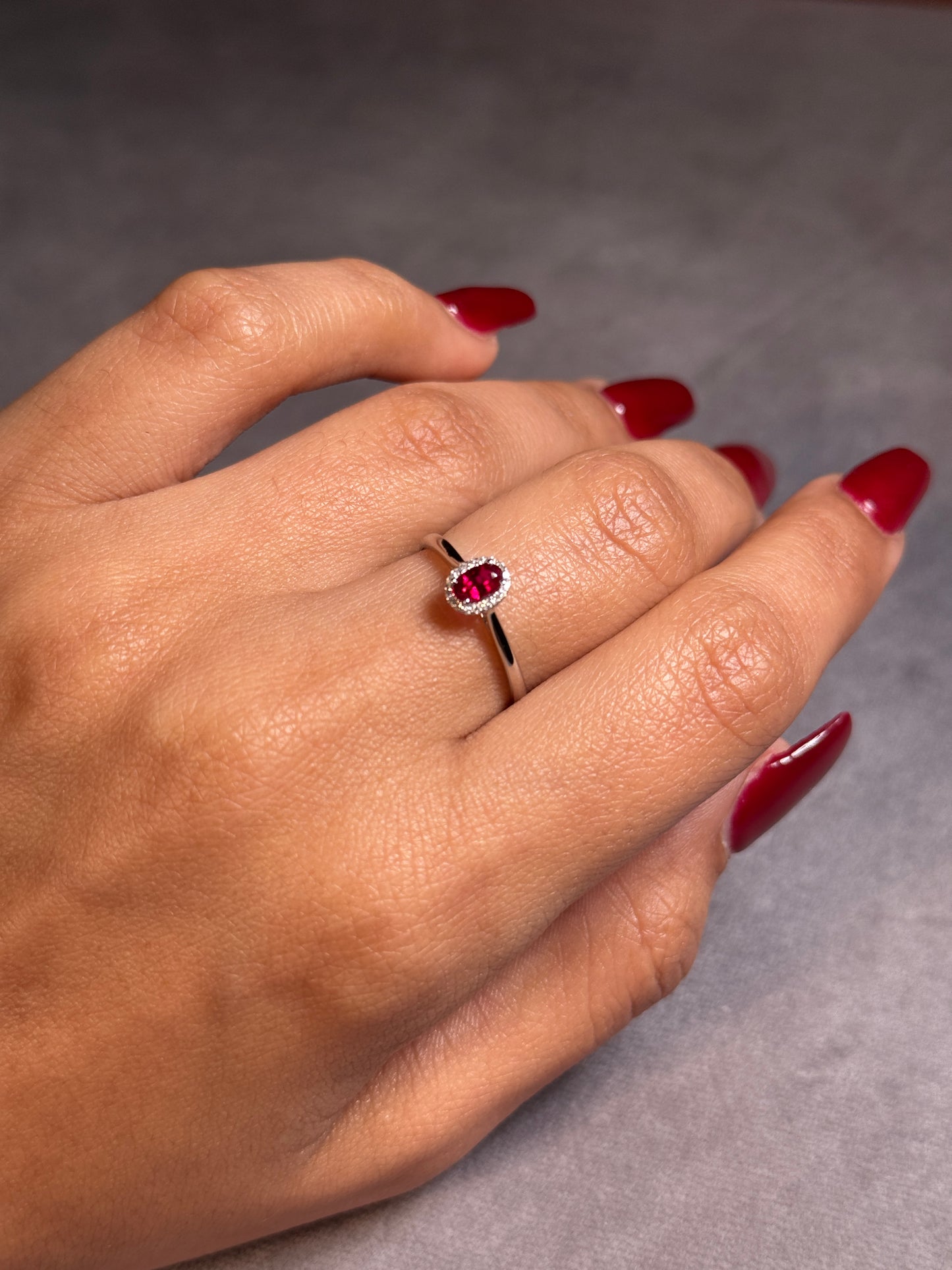 Oval Ruby & Diamond Halo Ring, 18K White Gold.